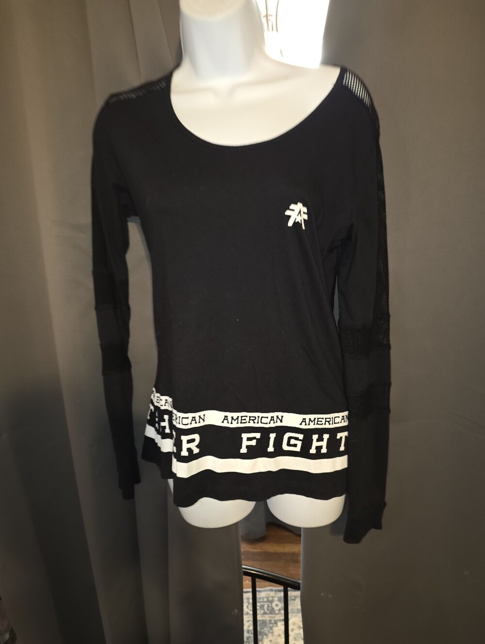 American Fighter Women's Black Long Sleeve Top with White Logo Hem